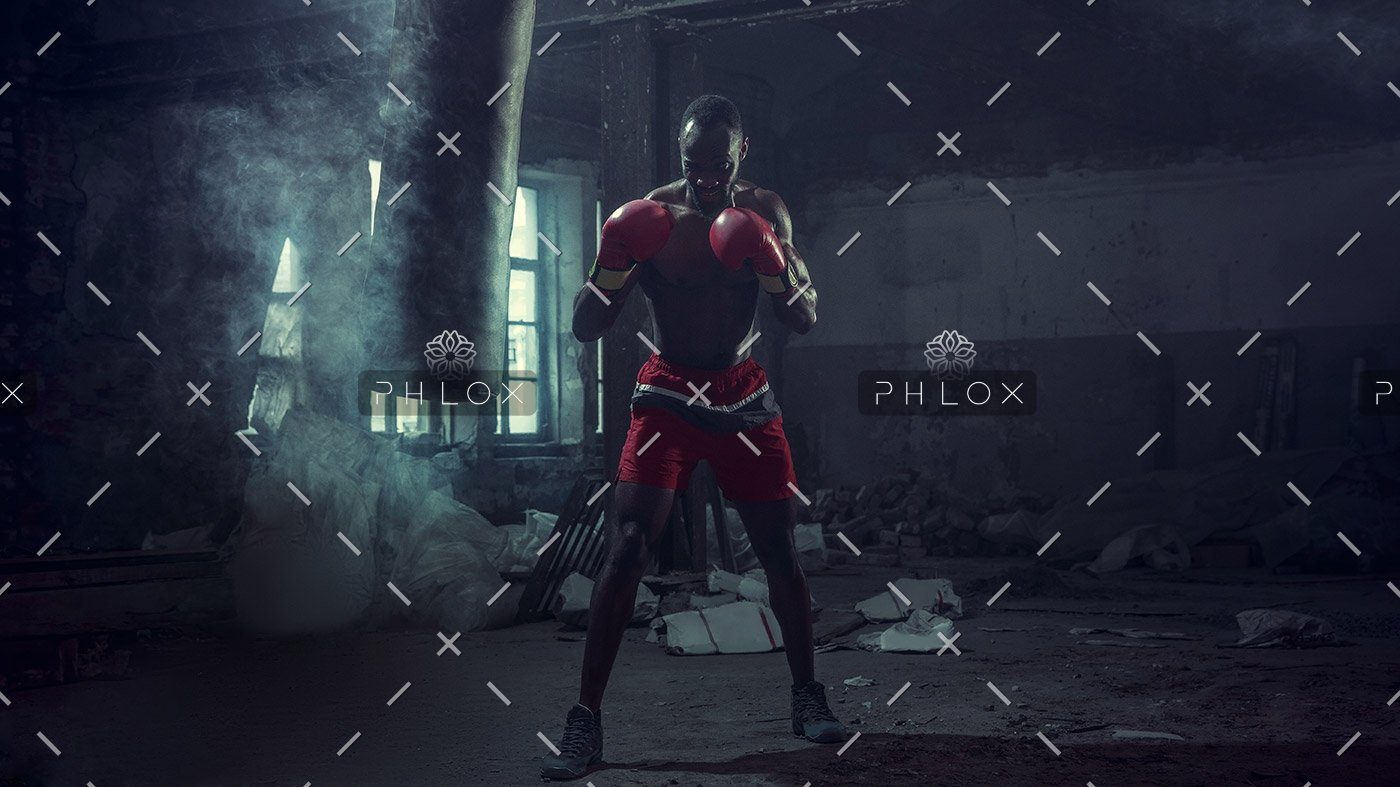 demo-attachment-400-hand-of-boxer-over-black-background-strength-L7JXP4Q